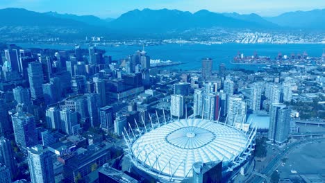 BC-Place-Stadium-CFL-Birds-top-view-overlooking-the-downtown-peninsula-Plaza-of-Nations-next-to-Stanley-Park-North-Vancouver-harbor-with-mountains-and-the-commercial-freighter-port-of-East-Hastings