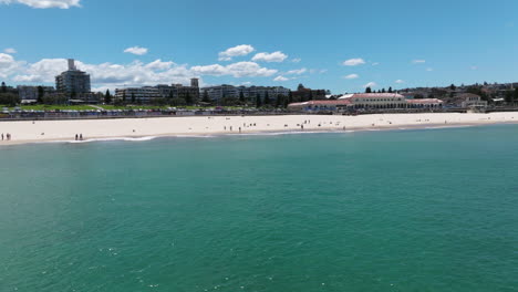 Turquoise-Ocean-At-Bondi-Beach,-Sydney,-NSW,-Australia---aerial-drone-shot