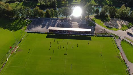 Aerial-rise-showing-soccer-game-in-Austrian-city-Kuchl