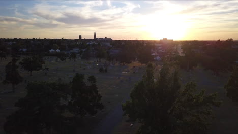 Aerial-shot-overhead-a-graveyard-in-Georgia-with-the-sun-setting-behind