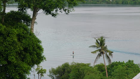 Tropical-Seascape-With-Person-Paddle-Boarding-In-Moso-Island,-Coast-of-Efate,-Vanuatu,-Shefa-Province