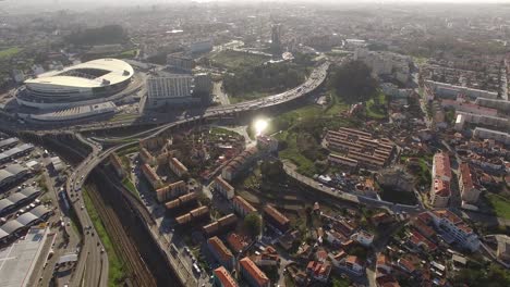 Aerial-view-overlooking-the-FC-Porto-football-stadium,-Estadio-de-Dragao-arena,-in-Oporto-city,-Portugal---High-angle,-drone-shot-03