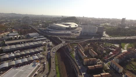 Aerial-view-overlooking-the-FC-Porto-football-stadium,-Estadio-de-Dragao-arena,-in-Oporto-city,-Portugal---High-angle,-drone-shot-01
