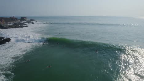 Aerial-view-of-surfers-lining-up-in-Mexico-to-take-on-big-waves