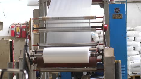Plastic-Cellophane-Bags-Going-Over-Rollers-At-Factory
