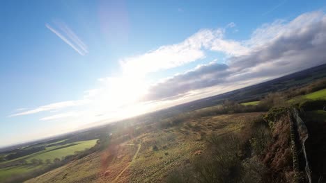 FPV-drone-flying-across-Billinge-hill-beacon-farmland-boundary-in-autumn-Lancashire-landscape