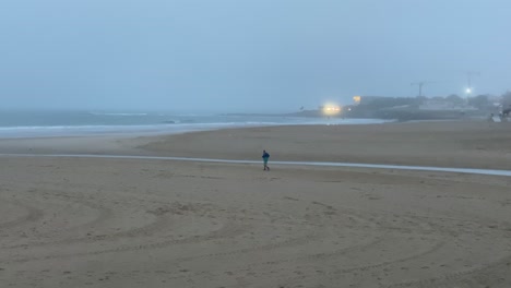 Older-man-running-along-the-beach-early-in-the-morning-during-covid