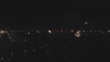 Moving-skyline-drone-shot-of-new-years-fireworks
