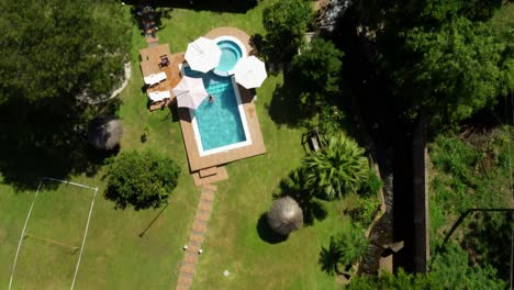 Top-down-aerial-view-of-property-with-a-swimming-pool