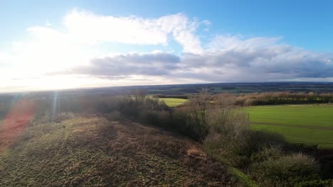 FPV-drone-flying-across-Billinge-hill-beacon-autumn-countryside-Lancashire-farmland