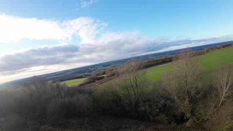 FPV-drone-flying-over-rural-Billinge-hill-beacon-autumn-Lancashire-farmland-landscape