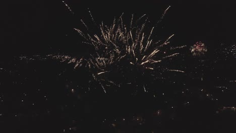 Skyline-drone-shot-of-beautiful-fireworks-up-close