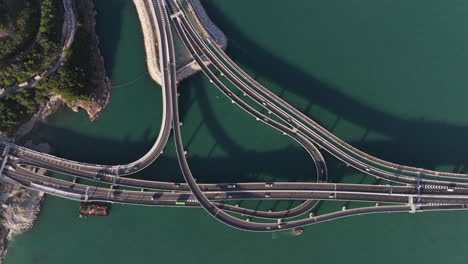 Sideways-aerial-drone-shot-of-traffic-on-new-Cross-Bay-Bridge-near-Tsuen-Kwan-O,-Hong-Kong