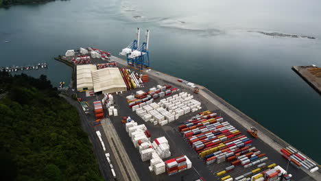 Cargo-containers-and-cranes-in-port-of-Dunedin-city,-New-Zealand,-aerial-view