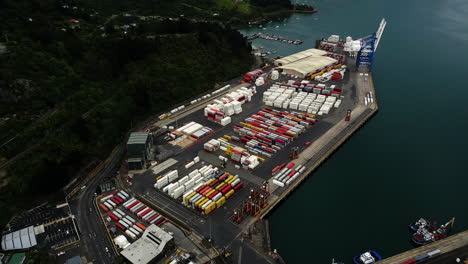 Aerial-view-of-commercial-logistic-port-chalmers-in-dunedin-new-Zealand-import-and-export-overseas-of-goods