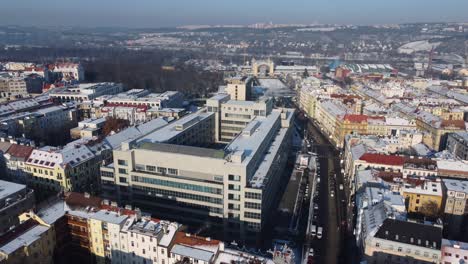 Aerial-drone-view-of-National-Gallery-building-in-Prague,-Czech-Republic,-traffic-on-street,-winter-day