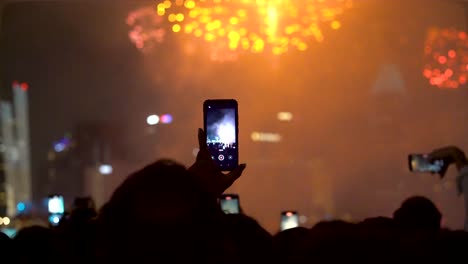 People-taking-photos-of-new-year-fireworks