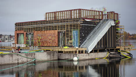 Construction-time-lapse-of-a-crew-building-a-floating-restaurant-along-the-waterfront