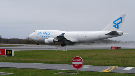 A-Jumbo-Jet-Sprays-Water-From-Runway-When-Setting-Thrust-for-Takeoff