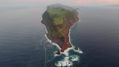 Epic-aerial-over-headland-at-Ponta-dos-Rosais,-slender-São-Jorge-Island,-Azores