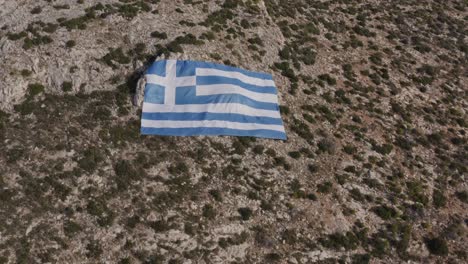 Aerial---Huge-Greek-Flag-on-Mount-Hymettus-in-Athens,-Greece