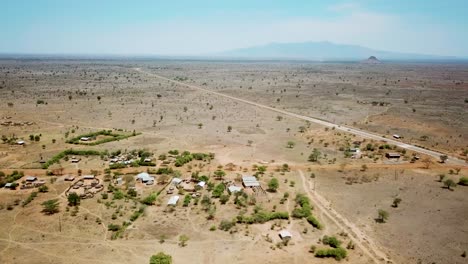 Aerial-view-zooming-out-from-a-village-of-Karamoja,-also-known-as-Manyatta-or-Ere,-on-a-sunny-day-in-Uganda,-Africa
