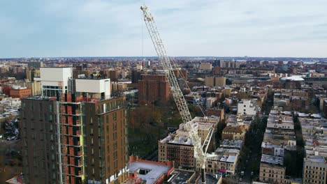 Tower-crane-lifting-construction-material-rods-at-Flushing-NewYork