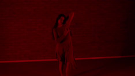 Female-dancer-dancing-in-the-red-room