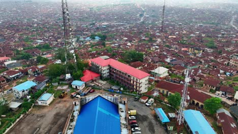 Aerial---Forward-tilt-down-shot-of-Mapo-hall-and-Ibadan-metropolis