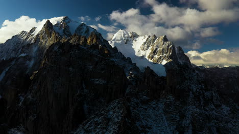 Epic-rotating-aerial-drone-shot-of-the-large-peak-of-the-Ak-Sai-glacier-in-Kyrgyzstan