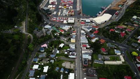 Containers-In-Port-Chalmers-In-Dunedin,-New-Zealand---aerial-drone-shot