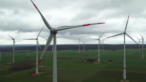 Eco-Friendly-Energy-in-Germany:-High-Angle-View-of-Wind-Turbines-Surrounded-by-Farmland-close-to-Bad-Wünnenberg,-Paderborn-in-North-Rhine-Westphalia