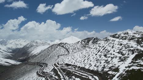 Aerial-view-of-Road-through-babusar-pass-in-winters,-via-Karakorum-highway-to-Gilgit-baltistan,-KPK-junction