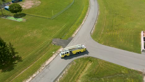 Drone-shot-of-a-firetruck-being-driven-in-reverse-in-controlled-conditions