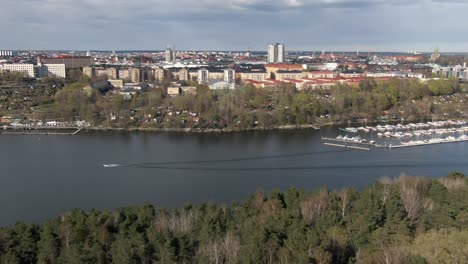Aerial-tilt-up-shot-revealing-Swedish-capital-Stockholm-on-sunny-day