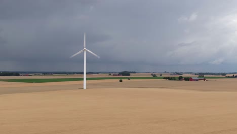 Pull-in-drone-shot-showing-dramatic-scene-with-dark-clouds-of-vast-Swedish-countryside
