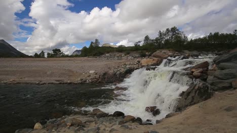 Powerful-waterfall-by-the-lake-Gjevilvatnet,-Big-water-flow