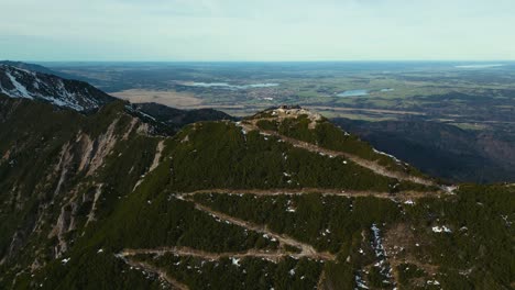Epic-drone-aerial-at-Herzogstand-mountain-top-peak