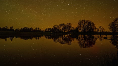 Milky-Way-Galaxy-sky-reflecting-on-calm-lake-water,-fusion-time-lapse