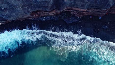 Bird's-Eye-Shot-Of-Cool-Waves-Fading-Smoothly-On-Rocky-Beach,-Tenerife,-Spain