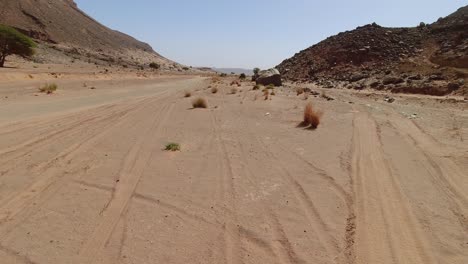 Point-of-view-of-the-driver-going-fast-in-a-desert-valley