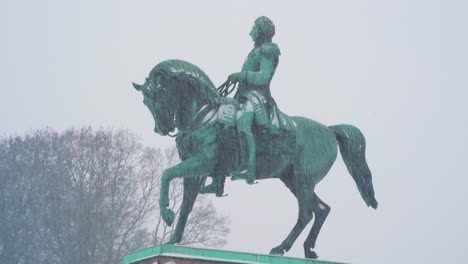 Heavy-Snow-Falling-On-Statue-of-King-Charles-John-On-The-Palace-Square-In-Oslo,-Norway