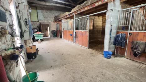 Empty-horse-stable-with-box-gate-open