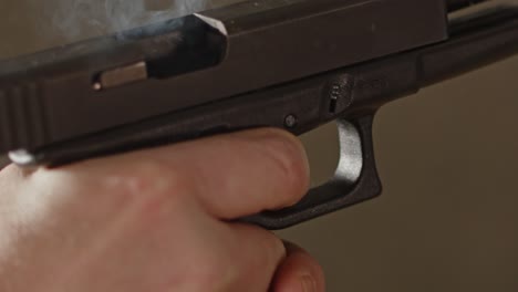 Close-up-of-Glock-17-handgun-being-fired-and-ejecting-the-casing