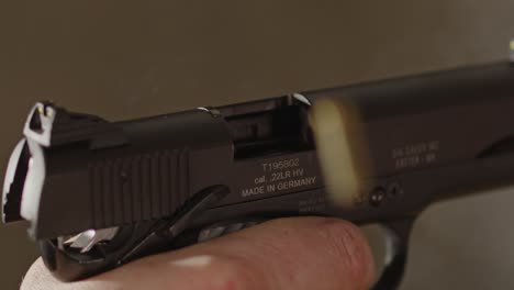 Pistol-being-fired-in-slow-motion-and-shell-casing-flying-out