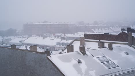 Static-Shot-Of-Snow-Falling-Over-Rooftops-Of-Buildings-At-St