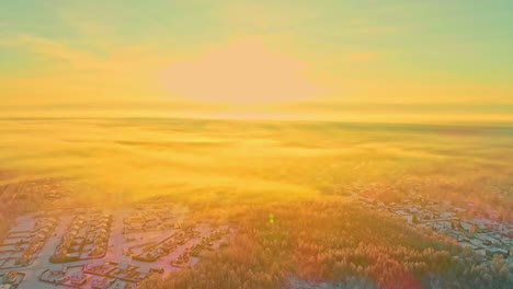 A-bright-sunrise-morning-in-winter-above-a-suburb-in-the-forest---aerial-flyover