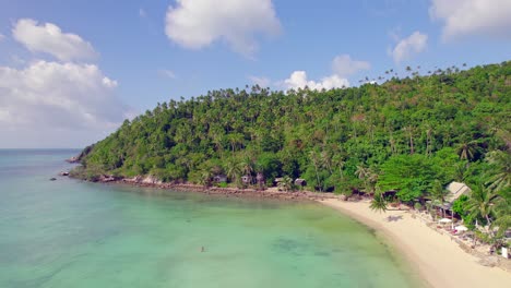 4k-Aerial-Drone-Footage-Forward-Orbit-Shot-of-Salad-Beach-on-Koh-Phangan-in-Thailand-with-Fishing-Boats,-Teal-Water,-Coral,-and-Green-Jungles