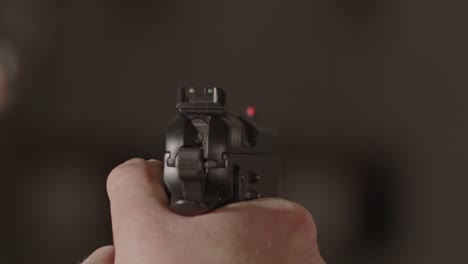 9mm-pistol-firing-a-single-range-with-a-out-of-focus-background