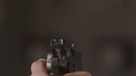 9mm-pistol-with-the-Hammer-striking-down-on-firing-pin-and-shooting-a-bullet-in-slow-motion